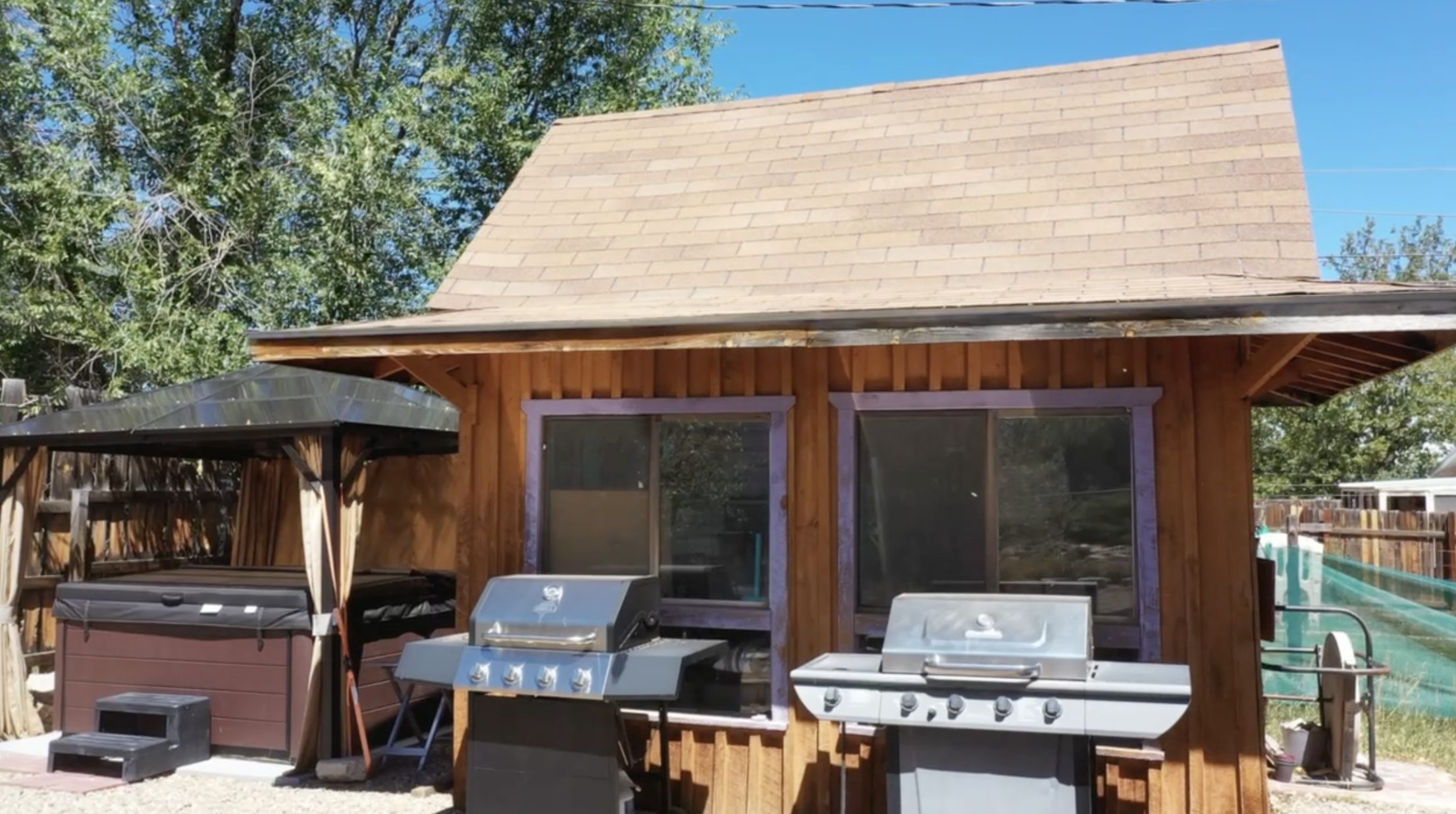 Shed and hot tub in the backyard